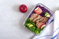 Tasty healthy lunch of vegetables and baked turkey. Salad of red cabbage, spinach, apples, fresh cucumbers with diet meat in a Royalty Free Stock Photo