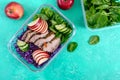 Tasty healthy lunch of vegetables and baked turkey. Salad of red cabbage, spinach, apples, fresh cucumbers with diet meat in a Royalty Free Stock Photo