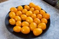 Tasty and healthy yellow ripe tomatoes on a plate. Royalty Free Stock Photo