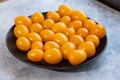 Tasty and healthy yellow ripe tomatoes on a plate. Royalty Free Stock Photo