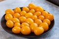 Tasty and healthy yellow ripe tomatoes on a plate. Royalty Free Stock Photo