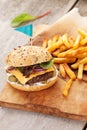 Tasty home made burger served with crispy fries.