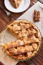 Eating sweet food context. Traditional holidays apple pie, slice on white plate and apples. Relishing sweet treats Royalty Free Stock Photo