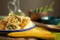 Tasty homemade baked puff pastry pies stuffed with chicken, cheese and pepper on green background close-up.healthy eating concept