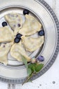 Tasty, homemade dumplings with blueberries - summer dish for kids