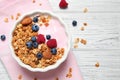 Tasty homemade granola served on white table, flat lay. Healthy breakfast Royalty Free Stock Photo