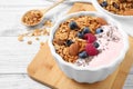 Tasty homemade granola served on wooden table. Healthy breakfast Royalty Free Stock Photo