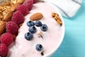 Tasty homemade granola served on wooden table, closeup. Healthy breakfast Royalty Free Stock Photo