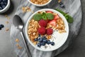 Tasty homemade granola with yogurt and berries on table, flat lay. Healthy breakfast Royalty Free Stock Photo