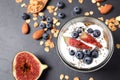 Tasty homemade granola with yogurt on grey table, flat lay. Healthy breakfast Royalty Free Stock Photo