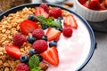 Tasty homemade granola with yogurt on grey table. Healthy breakfast Royalty Free Stock Photo