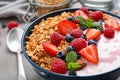 Tasty homemade granola with yogurt on grey table. Healthy breakfast Royalty Free Stock Photo