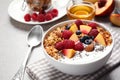 Tasty homemade granola with yogurt on grey table. Healthy breakfast Royalty Free Stock Photo