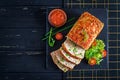 Tasty homemade ground baked chicken meatloaf with green peas and broccoli Royalty Free Stock Photo