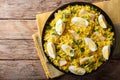 Tasty homemade Kedgeree with fish, boiled eggs, cilantro close-up on a plate. horizontal top view Royalty Free Stock Photo