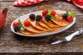 Tasty homemade pancakes with berries