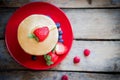 Tasty homemade pancakes with strawberries,blueberries and maple Royalty Free Stock Photo