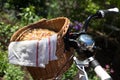 Tasty homemade rhubarb tart in a wickery basket on the bike Royalty Free Stock Photo