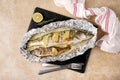 Tasty homemade roasted zander and perch served on table, top view.