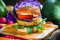 tasty, homemade, vegetarian hamburger on wooden table with fresh vegetables around. Concept of vegan life and healthy meatless Royalty Free Stock Photo