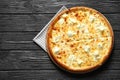 Tasty hot cheese pizza on wooden background Royalty Free Stock Photo