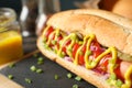 Tasty hot dog on cutting board Royalty Free Stock Photo