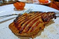 Tasty hot steak on a plate. Selective focus Royalty Free Stock Photo