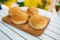 Tasty image of burger buns laying on cutting board Royalty Free Stock Photo