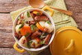 Tasty Irish coddle with pork sausages, bacon and vegetables in a Royalty Free Stock Photo