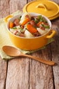 Tasty Irish coddle with pork sausages, bacon and vegetables in a Royalty Free Stock Photo