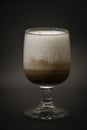 Tasty Italian coffee in a big glass. Is a typical mix of coffee and milk, is a n Italian cappuccino in a large fancy glass. All