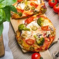 Tasty Italian homemade mini pizzas with broccoli, feta and olives Royalty Free Stock Photo