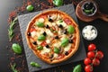 Tasty Italian pizza and ingredients on wooden background Royalty Free Stock Photo