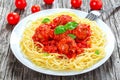 Tasty italian spahgetti with meatballs and tomato sauce, close-up