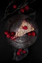 Tasty juicy raspberry tart with raspberries, rustic studio shot