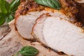 Tasty juicy roast pork tenderloin and basil macro