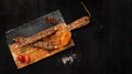 Tasty lamb and chicken arabic kebab skewer with onion, sauce and pepper aside, isolated on a dark wooden background