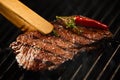 Tasty lean rump steak sizzling on a BBQ fire Royalty Free Stock Photo