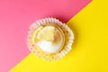 Tasty lemon cupcake on two tone Royalty Free Stock Photo