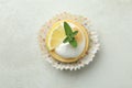 Tasty lemon cupcake on white textured Royalty Free Stock Photo