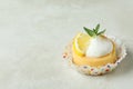 Tasty lemon cupcake on white textured Royalty Free Stock Photo