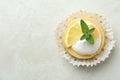 Tasty lemon cupcake on white textured Royalty Free Stock Photo