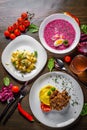 Tasty lunch set made of three meals, such as soup, salad and meat with mashed potato