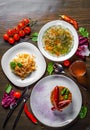 Tasty lunch set made of three meals, such as soup, salad and sausage with vegetable