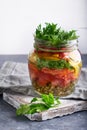 Tasty mason salad in jar. Homemade and healthy food Served on gray table Royalty Free Stock Photo