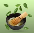 Tasty matcha tea in cup, whisk and leaves falling on light green background