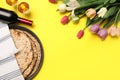 Tasty matzos, wine and fresh flowers on yellow background, space for text. Passover Pesach celebration Royalty Free Stock Photo