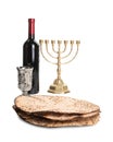 Tasty matzos, wine and menorah on white background. Passover Pesach celebration Royalty Free Stock Photo