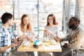 Positive colleagues having breakfast together