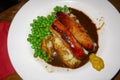 A tasty meal of Sausage, Mash and Peas with mustard on the side